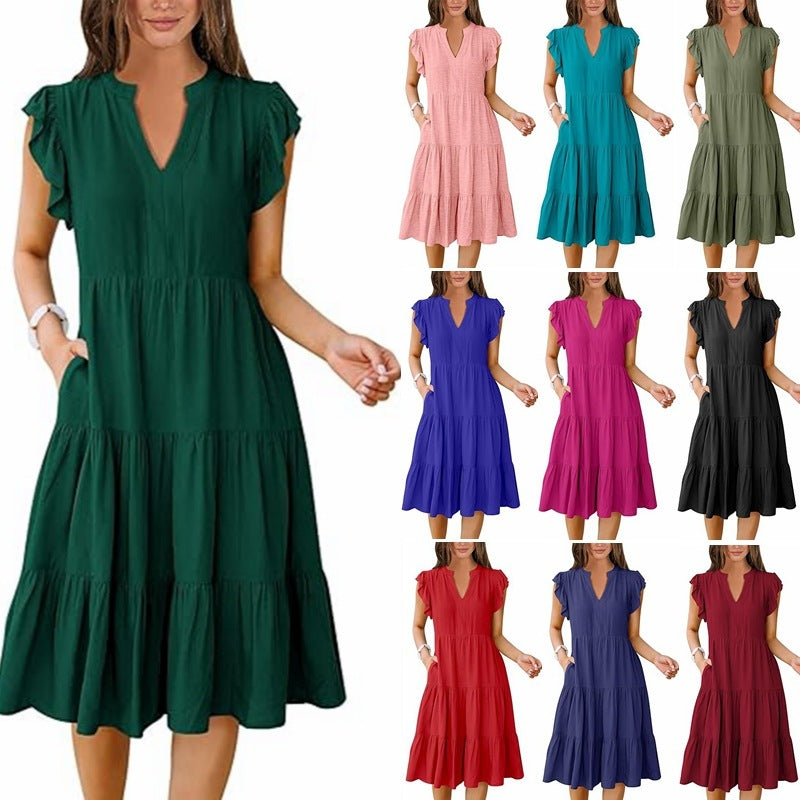 Green dress with a model and color swatches in various colors on a white background